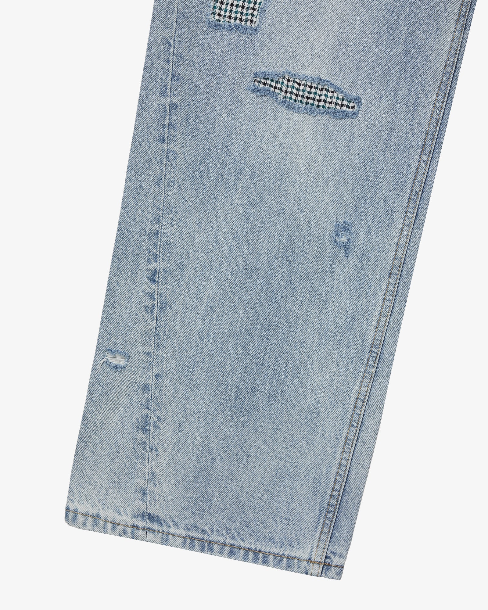 The hem of a pair of light blue denim pants from Korean brand aeae, for sale at Shim House