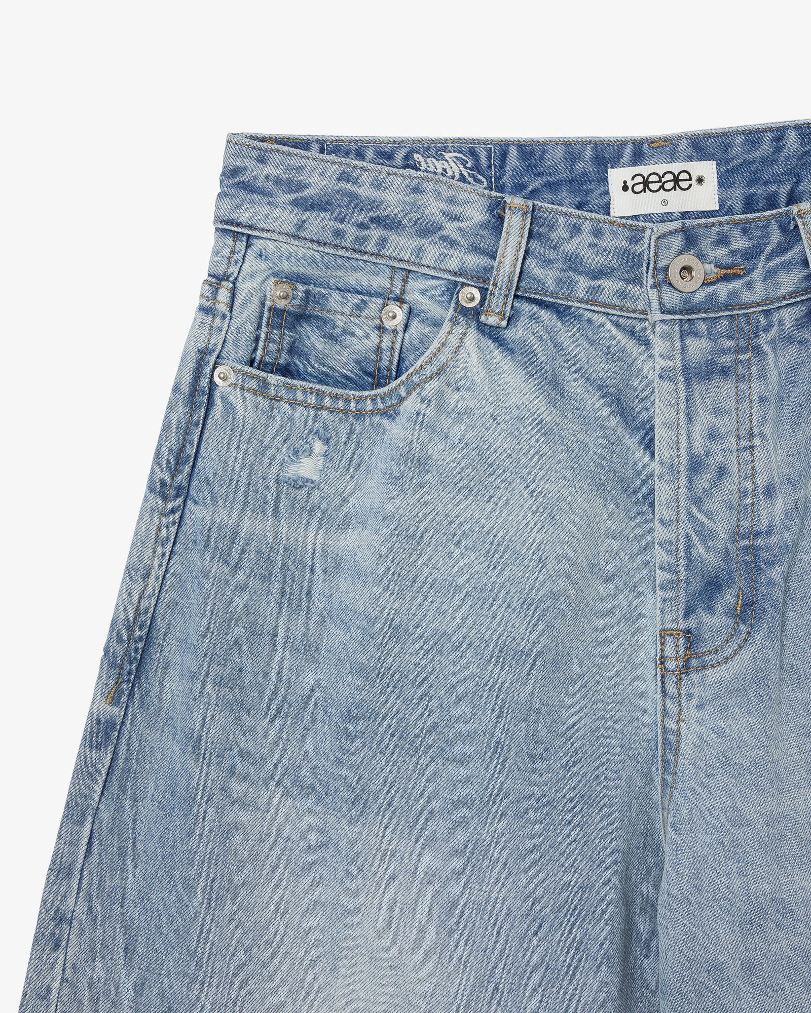 The front side pocket of a pair of light blue denim jeans from Korean brand aeae, for sale at Shim House