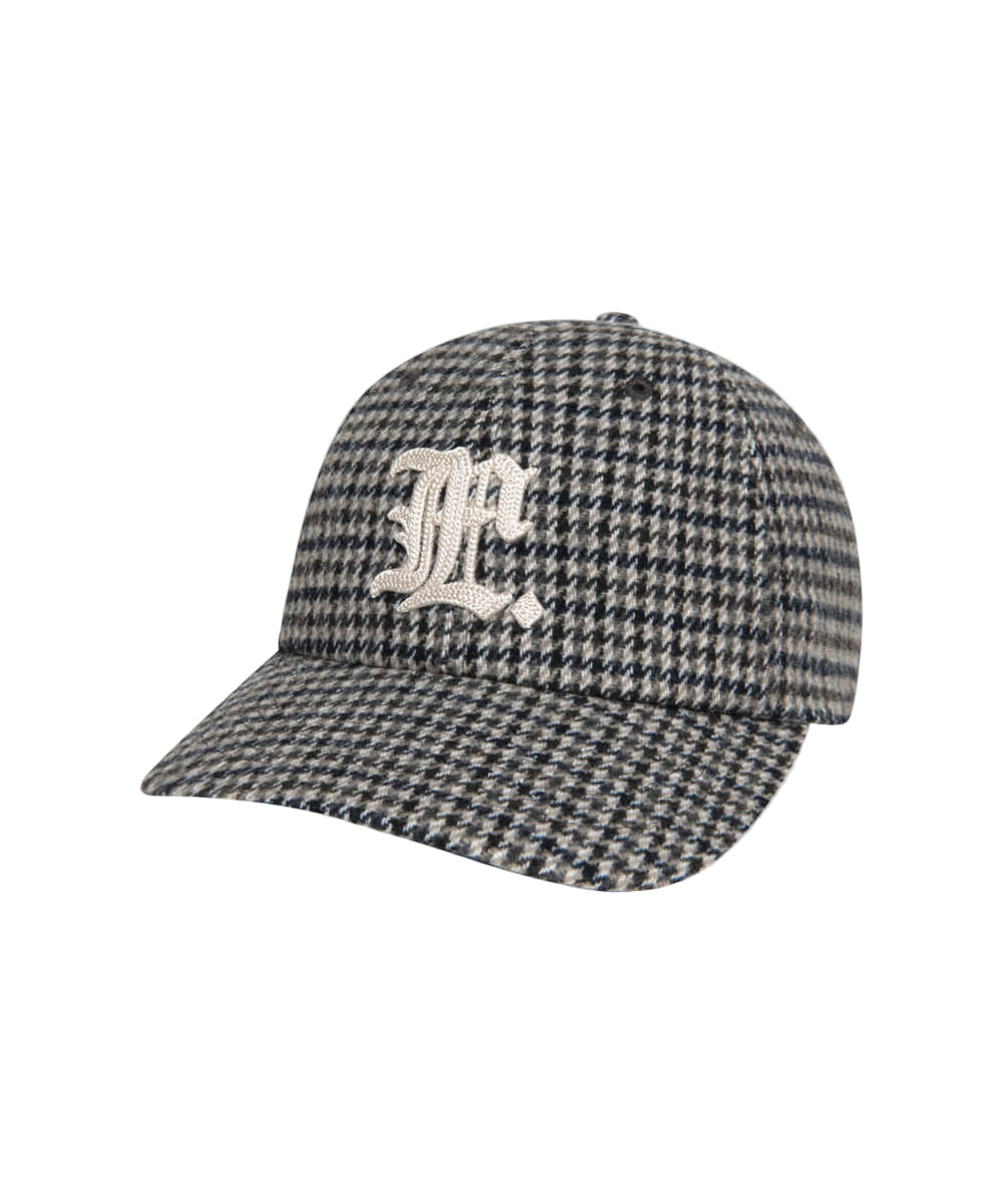 Houndstooth pattern cap with a logo on a white background